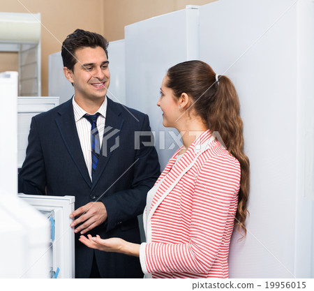 Satisfied customers looking at large fridges Satisfied customers looking at large fridges 19956015