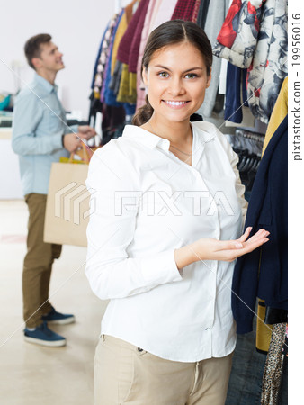Customers at the clothes store . 19956016