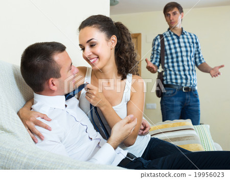 Man seeing girlfriend cheating on him. 19956023