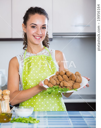 brunette with home-made croquettes brunette with home-made croquettes 19956164