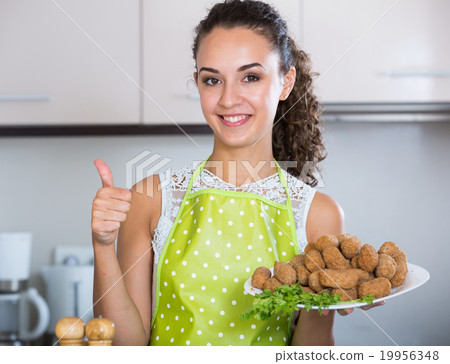 woman posing with plate of deep-fried kroketten woman posing with plate of deep-fried kroketten 19956348