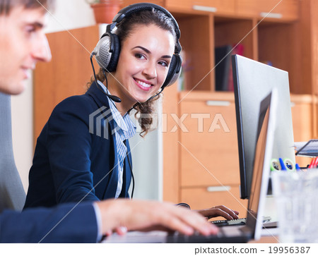 two happy help line operators two happy help line operators 19956387