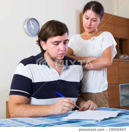 spouses discussing bills spouses discussing bills 19956947
