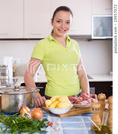 Housewife cooking soup at kitchen 19957072