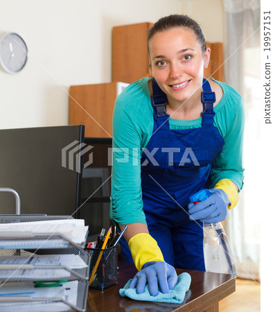 Woman cleaning at the office Woman cleaning at the office 19957151