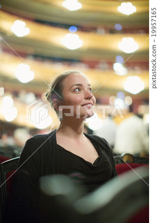Woman in auditorium of teatre Woman in auditorium of teatre 19957165