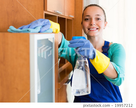 Woman cleaning at the office Woman cleaning at the office 19957212