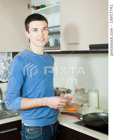 Man with batter and skillet Man with batter and skillet 19957741