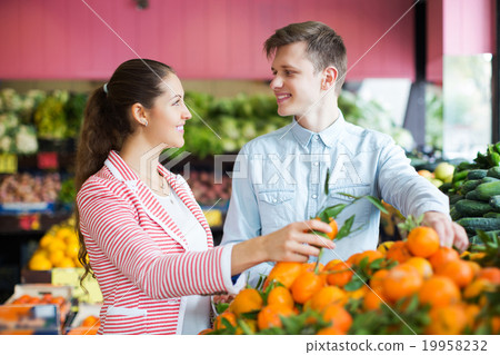 Customers buying oranges Customers buying oranges 19958232