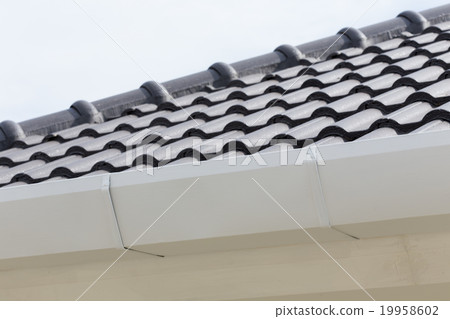 white gutter on the roof top of house white gutter on the roof top of house 19958602