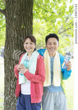 A couple with a drink bottle A couple with a drink bottle 19965182