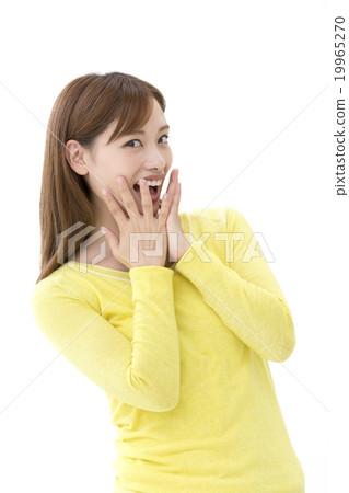 A woman putting her hand on her mouth 19965270
