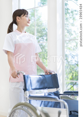 Women press a wheelchair 19965484