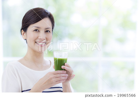 Women in their 40s with blue juice Women in their 40s with blue juice 19965566