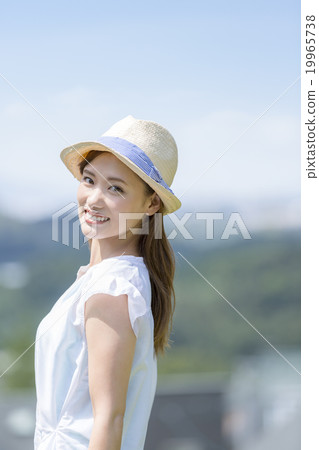 A woman wearing a hat A woman wearing a hat 19965738