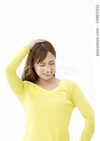 A woman putting her hand on her head A woman putting her hand on her head 19965932