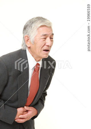 A senior businessman with a stomachache A senior businessman with a stomachache 19966589