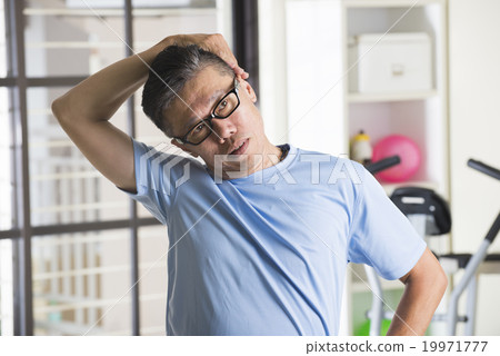 asian senior male streching at the gym asian senior male streching at the gym 19971777