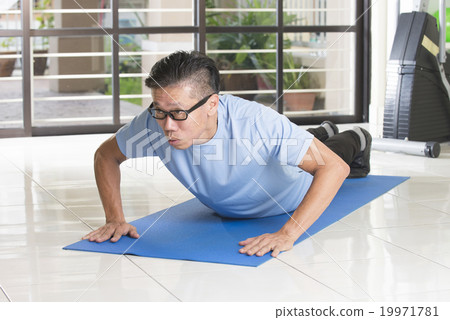 asian senior male streching at the gym asian senior male streching at the gym 19971781