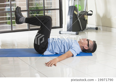 asian senior male streching at the gym 19971790