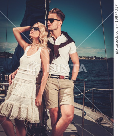 Stylish wealthy couple on a yacht 19974317