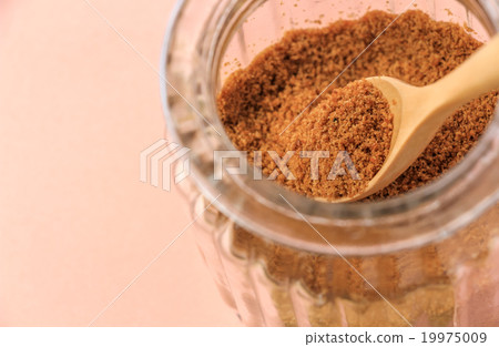 Pink background with coconut sugar jar 19975009