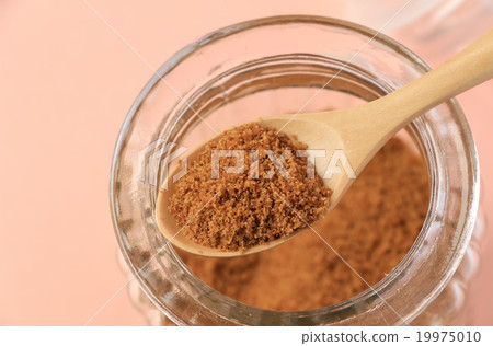 Pink background with coconut sugar jar Pink background with coconut sugar jar 19975010