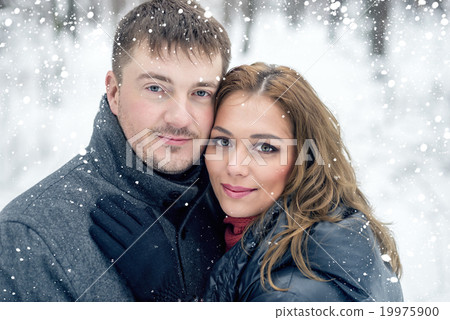 Portrait of happy couple in winter park Portrait of happy couple in winter park 19975900