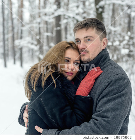 Portrait of happy couple in winter park Portrait of happy couple in winter park 19975902