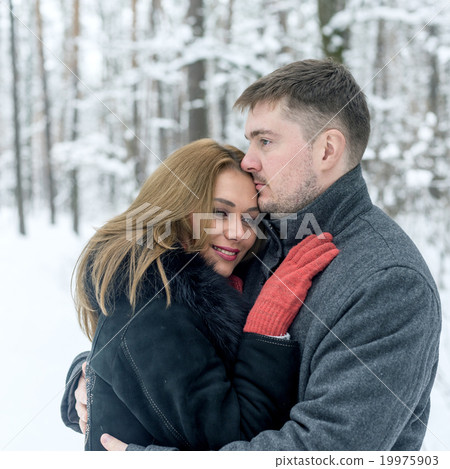 Portrait of happy couple in winter park Portrait of happy couple in winter park 19975903