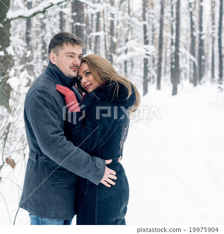 Portrait of happy couple in winter park Portrait of happy couple in winter park 19975904