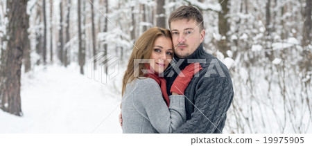Portrait of happy couple in winter park Portrait of happy couple in winter park 19975905
