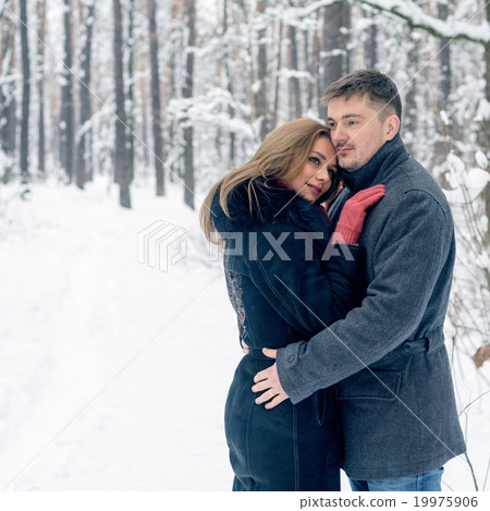 Portrait of happy couple in winter park Portrait of happy couple in winter park 19975906