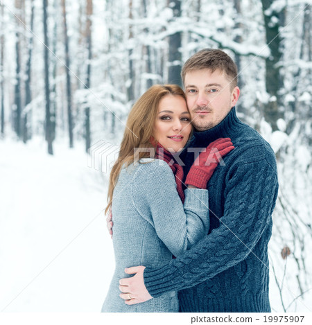 Portrait of happy couple in winter park 19975907