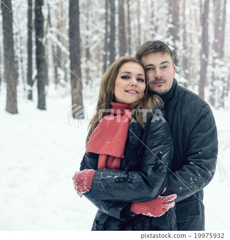 Portrait of happy couple in winter park Portrait of happy couple in winter park 19975932