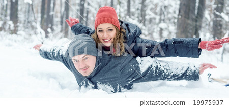 Portrait of happy couple in winter park Portrait of happy couple in winter park 19975937