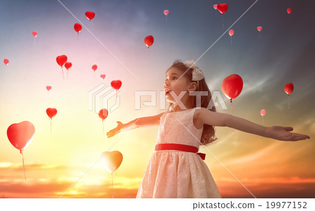 girl looking at red balloons 19977152