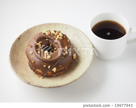 Chocolate nut donuts and coffee on a dish 19977943