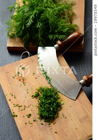 Chopping fresh dill 19978549