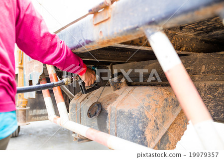filling oil at gas station 19979357