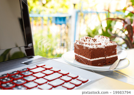 chocolate cakes and notebook computer chocolate cakes and notebook computer 19983794