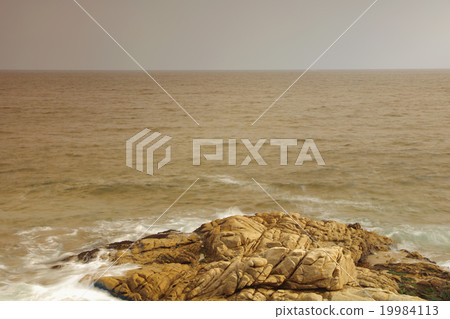 rocky sea coast and blurred water in shek o 19984113