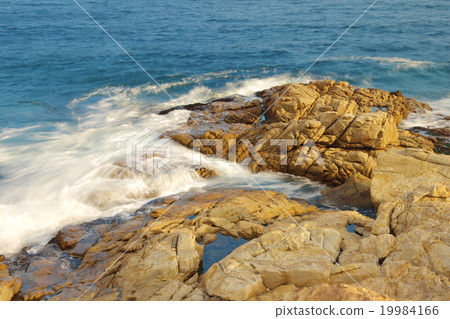 rocky sea coast and blurred water in shek o, 19984166