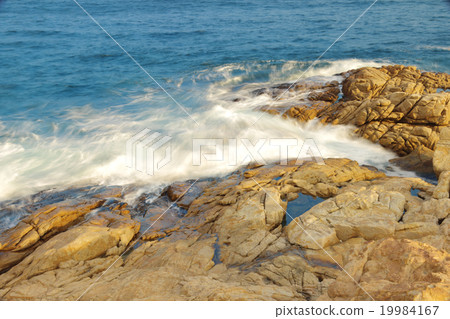 rocky sea coast and blurred water in shek o, 19984167