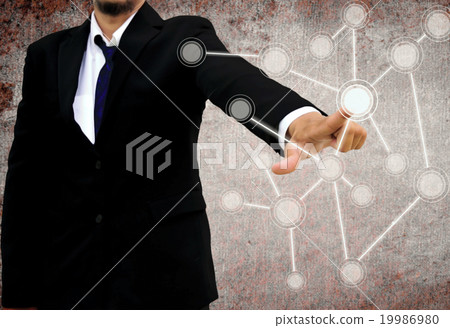 businessman pushing a touch screen interface 19986980