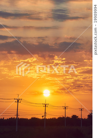 Sunrise at electricity post, silhouette picture Sunrise at electricity post, silhouette picture 19989994