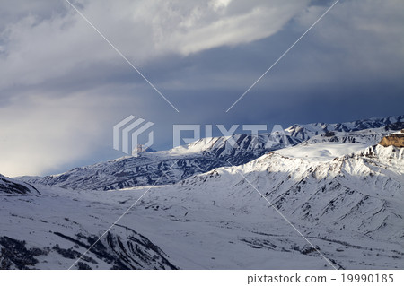 Winter mountains at evening and sunlight clouds 19990185