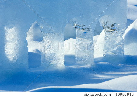 Transparent columns of ice on the snow 19993916