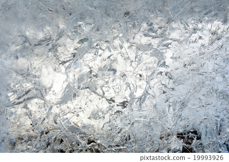 Glacial transparent block of ice with patterns. 19993926
