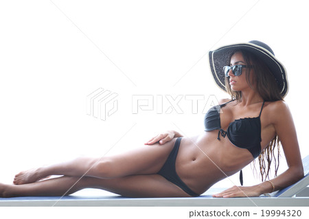 Woman on chaise lounge 19994320